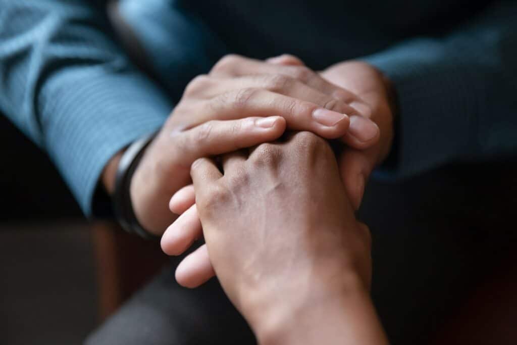 Two people holding hands.